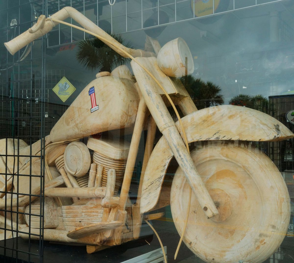 Harley Davidson made from wood ,displayed in a bike shop.