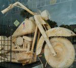 Harley Davidson made from wood ,displayed in a bike shop.