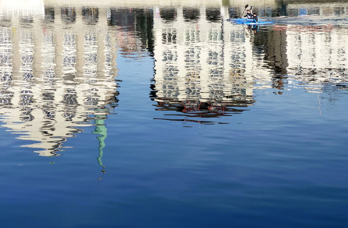 Cityscape reflected in water, Zurich, Switzerland