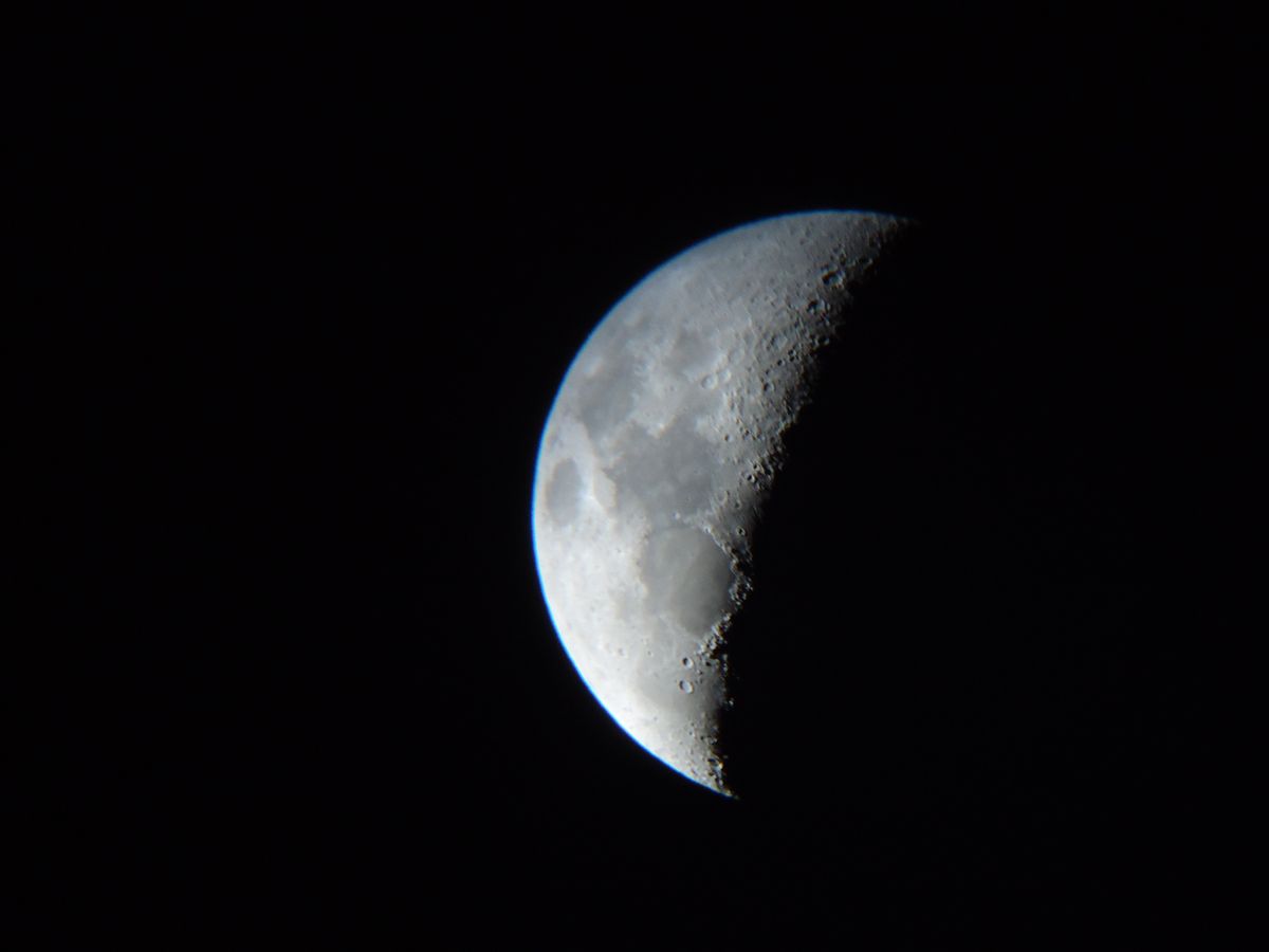 Shoot of the moon taken with a Cybershot DSC-W320 through an old Tasco telescope and 25mm lens.