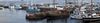 Assortment of fishing boats and private boats in a small harbour port.