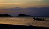 man in boat at sunset in thiland :)