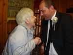 my mam and my brother on his wedding day. she had just won a bet with him and this was the special moment he payed up....it was like she was saying goodbye to her baby..♥