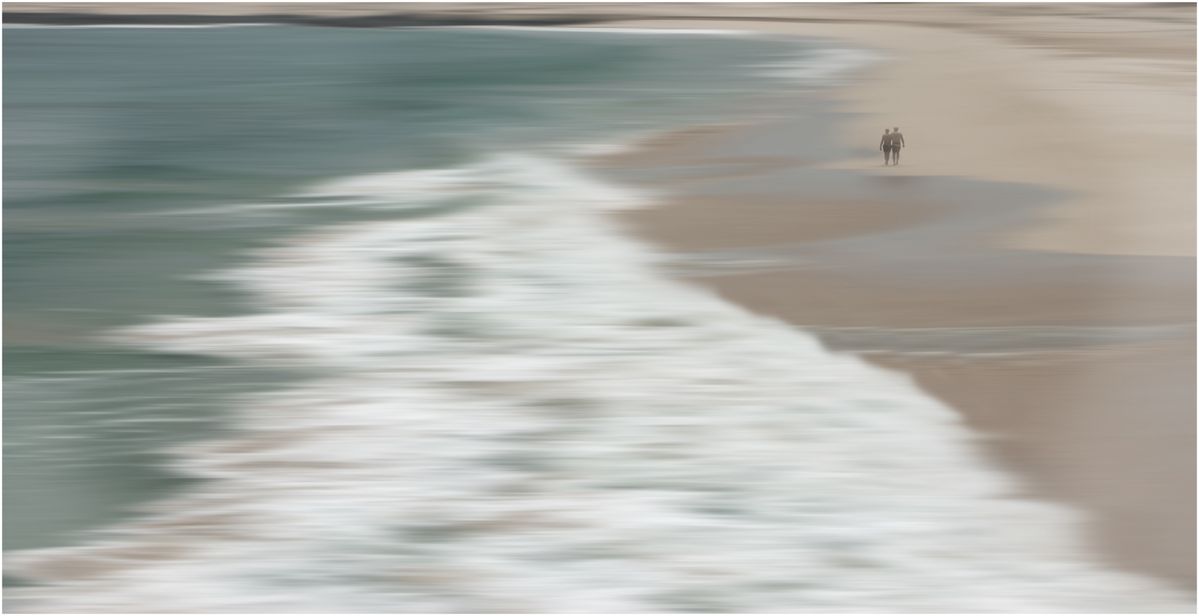 Two friends enjoying the tranquility of the faraway beach.